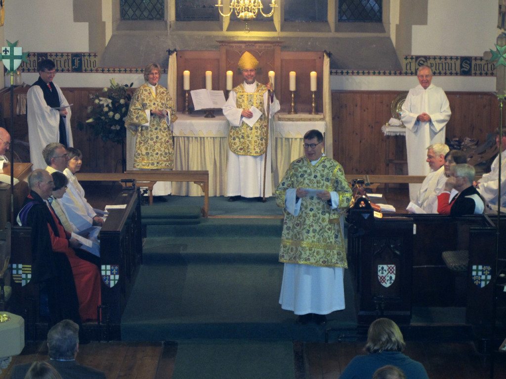 With the Bishop and Dean of the Diocese of Edinburgh at the altar, Canon Allan Maclean addresses his new congregation during his Institution on St Vincent's Day, 22 January 2015