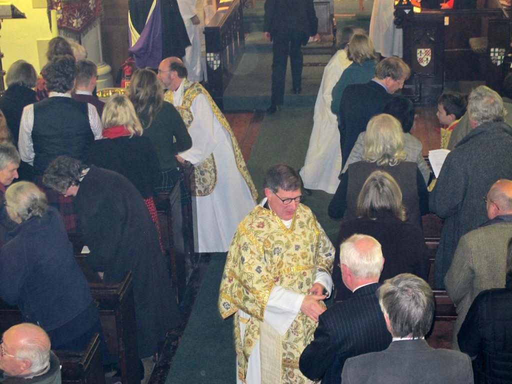 The Bishop of Edinburgh and Canon Allan Maclean greeting the congregation during the Institution Eucharist on St Vincent's Day, 22 January 2015