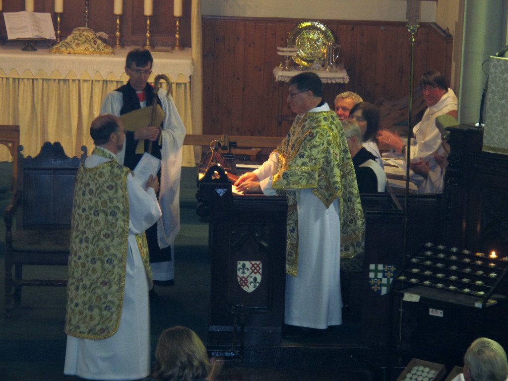 The Bishop of Edinburgh with his Chaplain at his side addresses Canon Allan Maclean during his Institution as Rector of St Vincent's on St Vincent's Day, 22 January 2015