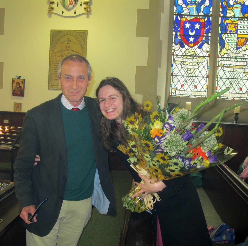 Vestry member, James Holloway presents flowers, speaking in Italian, to Mrs Eleonora Hull.
