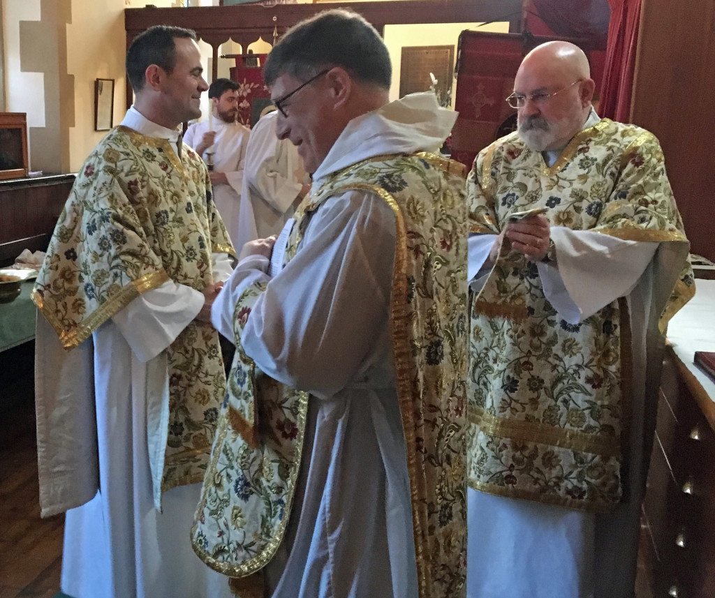 Oliver Brewer-Lennon, sub deacon, Canon Allan Maclean and Fr William Mounsey, deacon, prepare on Easter Day 2016 at St Vincent's